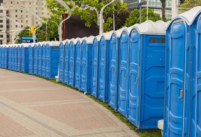 multiple portable restrooms in a neat and tidy row in Berlin